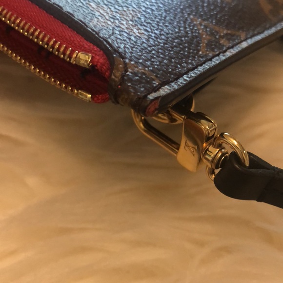 LV wristlet from World Tour collection. Authentic